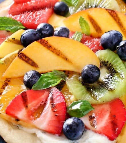 Grilled Fruit Pizza | Flatbread spread with a glorious honey herb whipped ricotta, topped with delicious grilled fruit, drizzled with honey and sprinkled with fresh herbs! | http://thechunkychef.com