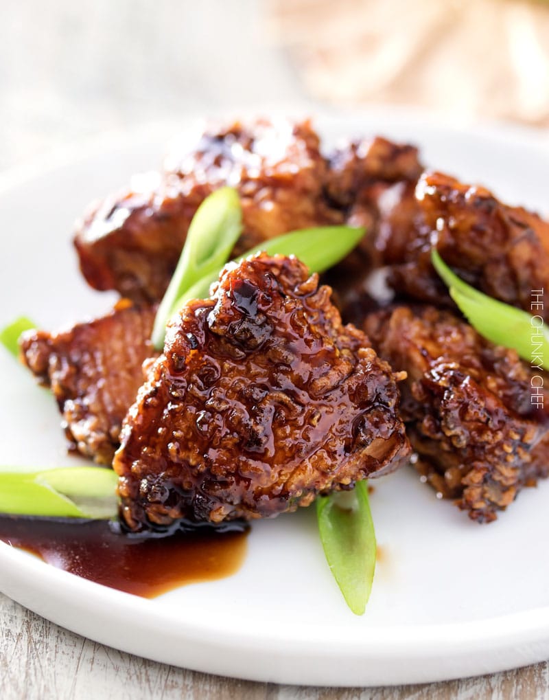 Bourbon Cider Boneless Wings | The ultimate boneless wings, marinated in buttermilk, fried until crispy, and tossed in a mouthwatering spicy bourbon apple cider sauce! | http://thechunkychef.com