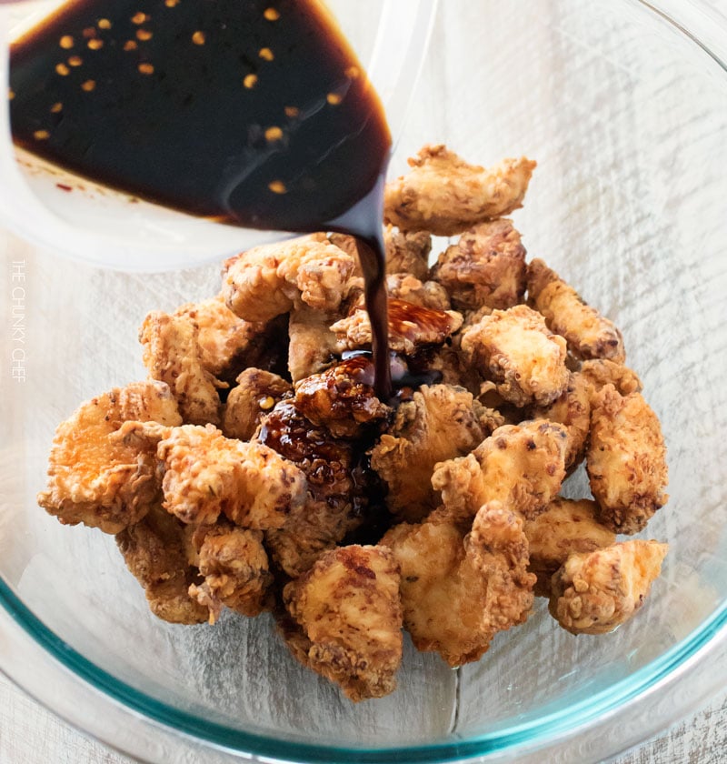 Bourbon Cider Boneless Wings | The ultimate boneless wings, marinated in buttermilk, fried until crispy, and tossed in a mouthwatering spicy bourbon apple cider sauce! | http://thechunkychef.com