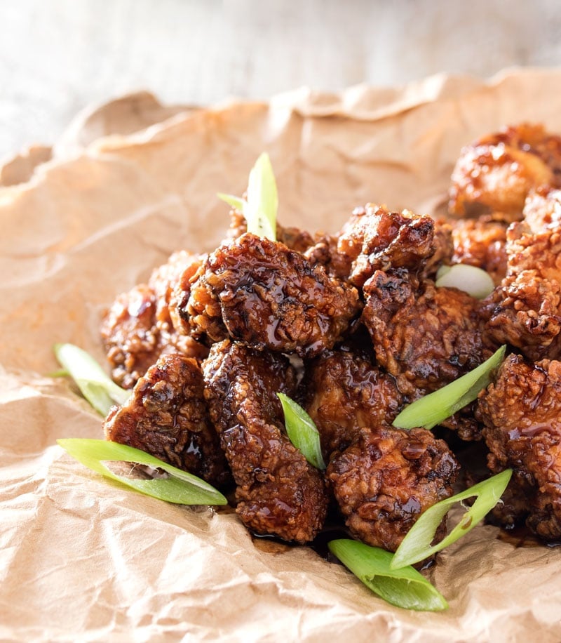 Bourbon Cider Boneless Wings | The ultimate boneless wings, marinated in buttermilk, fried until crispy, and tossed in a mouthwatering spicy bourbon apple cider sauce! | http://thechunkychef.com