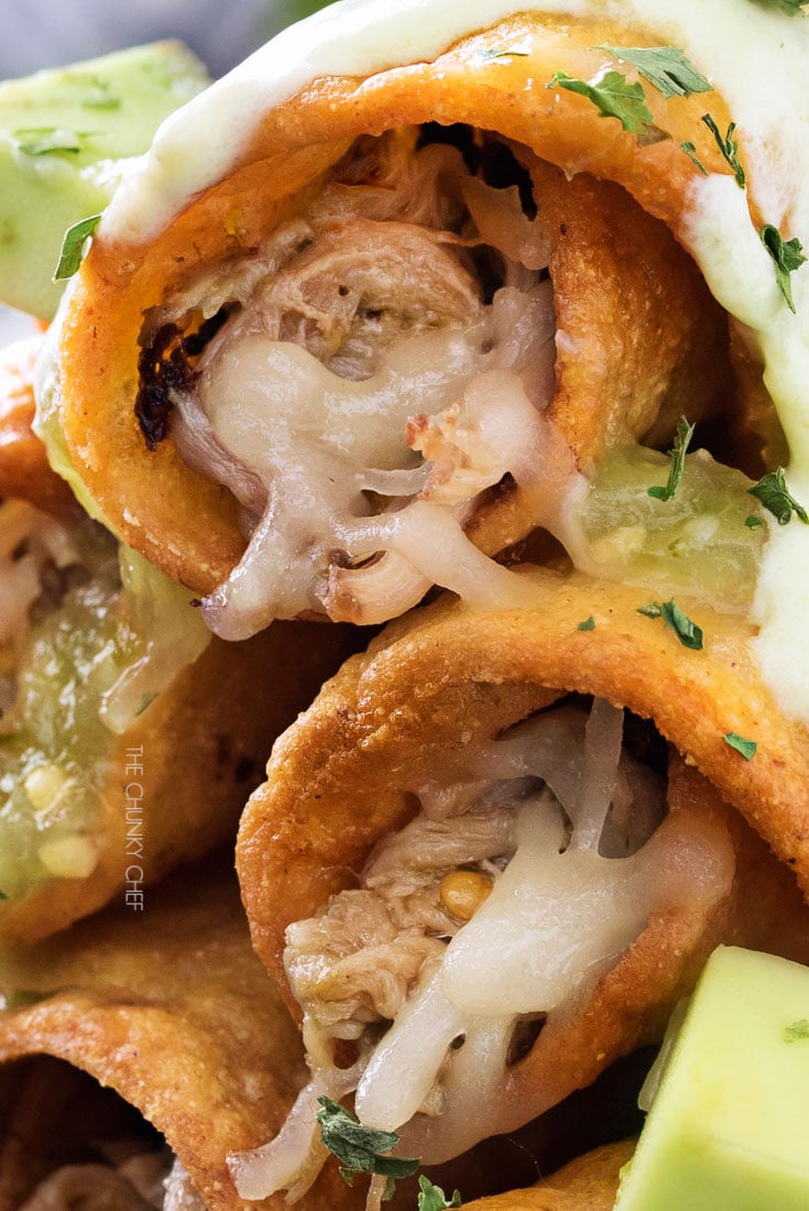 Slow Cooker Salsa Verde Pork Taquitos | The pork for these taquitos is simmered in a homemade salsa verde, shredded, piled high with cheese, wrapped up in tender corn tortillas and fried! | http://thechunkychef.com