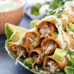 Slow Cooker Salsa Verde Pork Taquitos | The pork for these taquitos is simmered in a homemade salsa verde, shredded, piled high with cheese, wrapped up in tender corn tortillas and fried! | http://thechunkychef.com