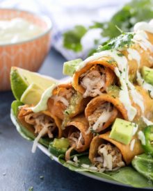 Slow Cooker Salsa Verde Pork Taquitos | The pork for these taquitos is simmered in a homemade salsa verde, shredded, piled high with cheese, wrapped up in tender corn tortillas and fried! | http://thechunkychef.com