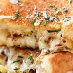 Ultimate Grilled Cheese | Gooey Gruyere and white cheddar cheese, savory rosemary butter, and herbed caramelized onions... need I say more? | http://thechunkychef.com