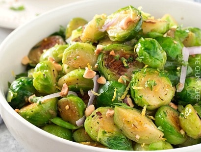 Brussels sprouts with Toasted Hazelnut Butter | Braised brussels sprouts and shallots are tossed with a savory toasted hazelnut and herb butter and ready to hit your table in less than 30 minutes! | http://thechunkychef.com