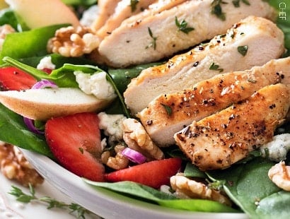Grilled Chicken Strawberry Spinach Salad | This strawberry spinach salad is full of walnuts, fruits, cheeses, topped with juicy grilled chicken and a homemade honey herb vinaigrette! | http://thechunkychef.com