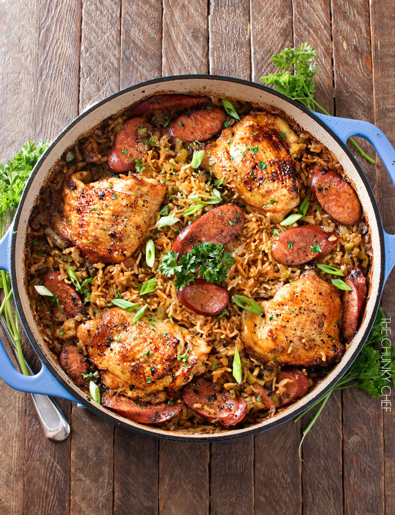 One Pot Chicken and Dirty Rice | Chicken thighs are cooked on top of a homemade dirty rice, which makes for the most flavorful Cajun-inspired dish you've ever had! Plus, all you need is one pot! | http://thechunkychef.com