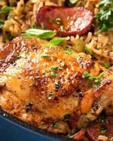 One Pot Chicken and Dirty Rice | Chicken thighs are cooked on top of a homemade dirty rice, which makes for the most flavorful Cajun-inspired dish you've ever had! Plus, all you need is one pot! | http://thechunkychef.com
