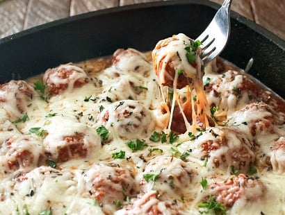 Meatball Parmesan Bake | Melt in your mouth homemade meatballs coated in marinara sauce, topped with Italian cheeses and baked to bubbly perfection! | http://thechunkychef.com