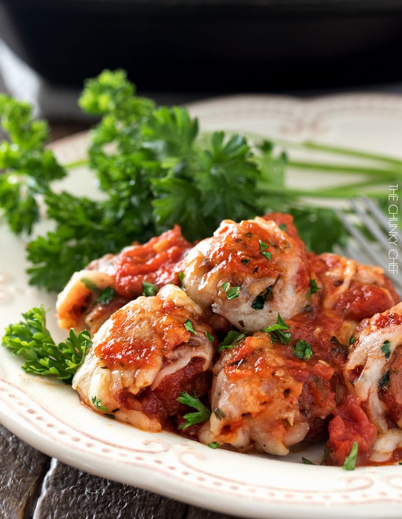 Meatball Parmesan Bake | Melt in your mouth homemade meatballs coated in marinara sauce, topped with Italian cheeses and baked to bubbly perfection! | http://thechunkychef.com