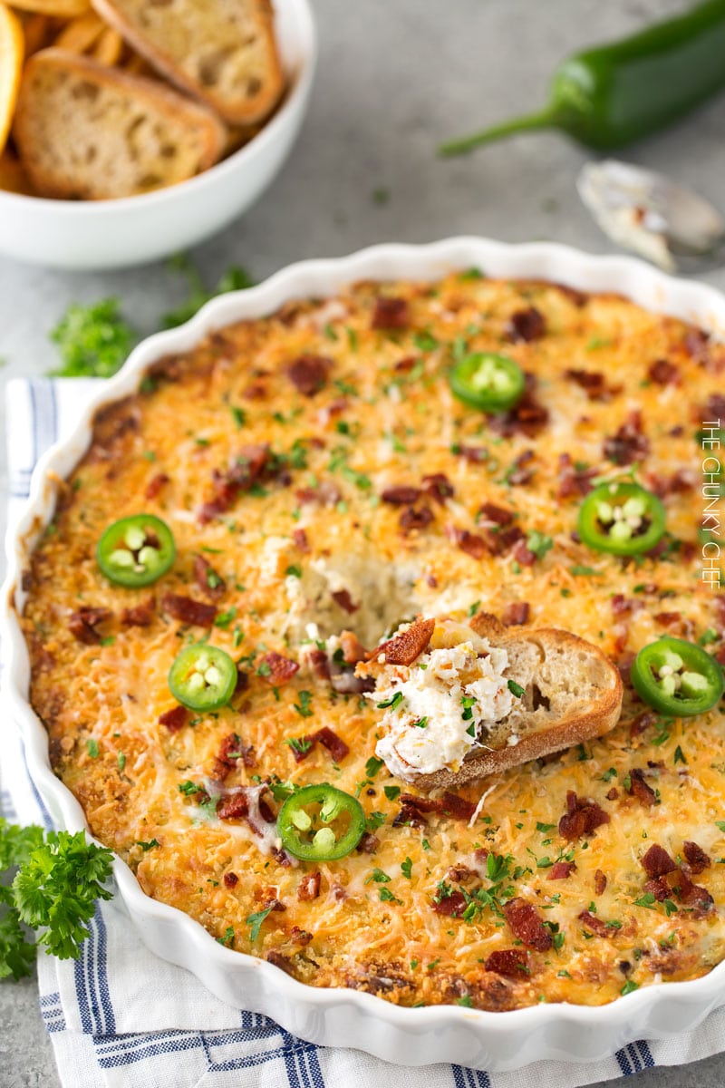 Cheesy Bacon Jalapeno Popper Dip | Warm and spicy, this ultra cheesy bacon jalapeno popper dip will be the hit of ANY party you bring it to! | http://thechunkychef.com