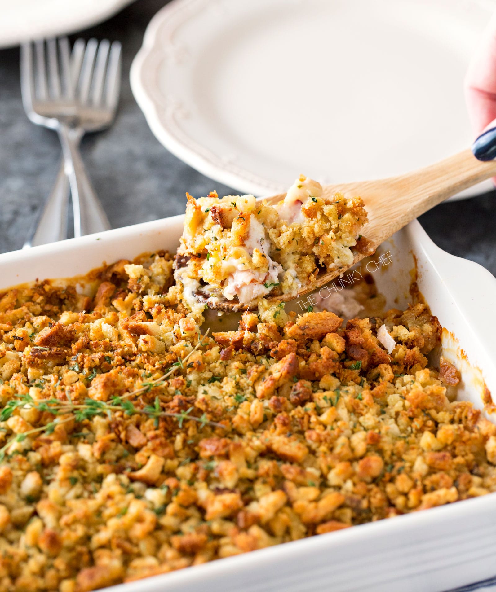 Chicken Cordon Bleu Casserole | A one pan family style casserole full of chicken, ham, swiss cheese, creamy herb sauce and savory stuffing! | http://thechunkychef.com