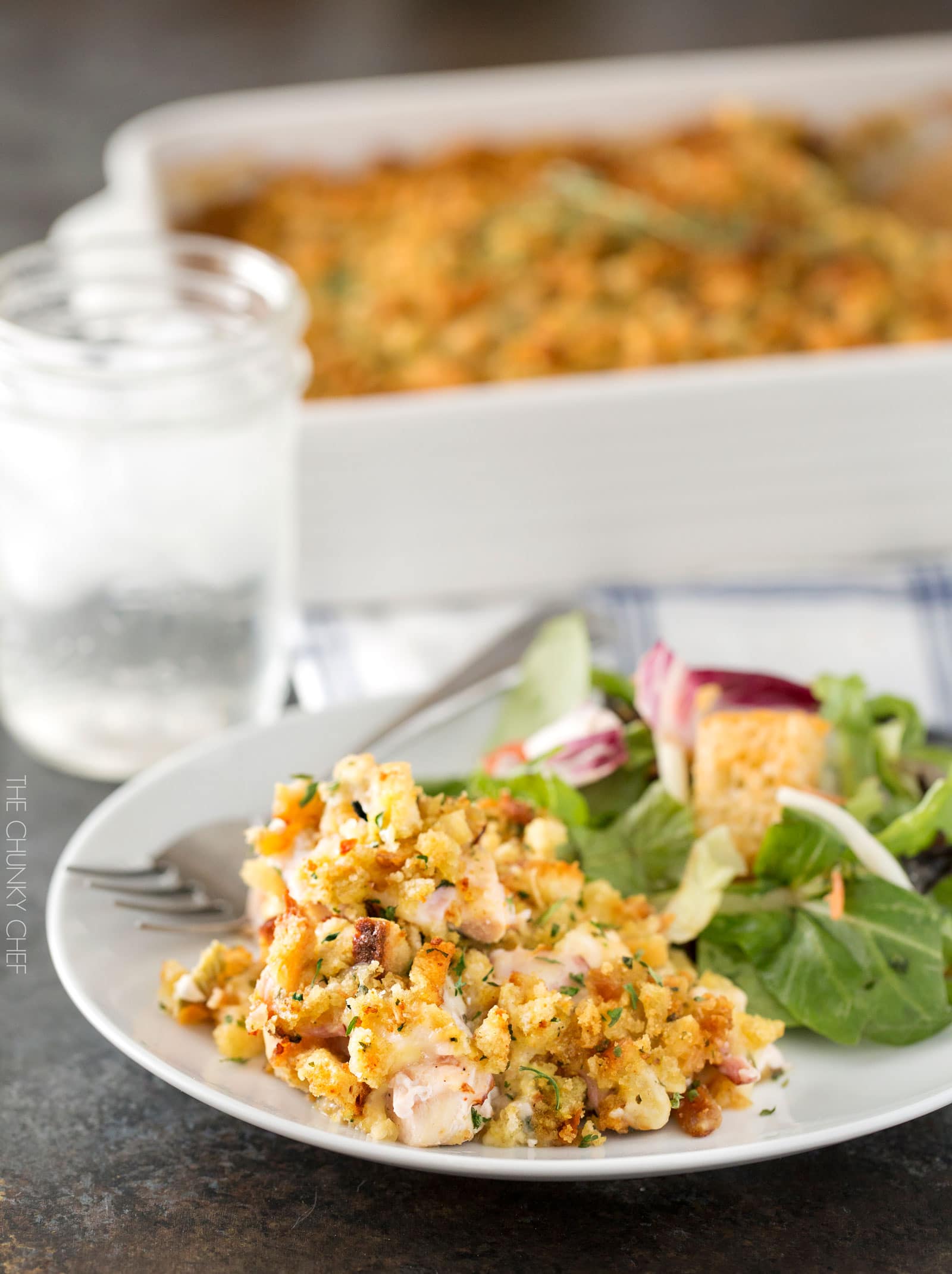 Chicken Cordon Bleu Casserole | A one pan family style casserole full of chicken, ham, swiss cheese, creamy herb sauce and savory stuffing! | http://thechunkychef.com