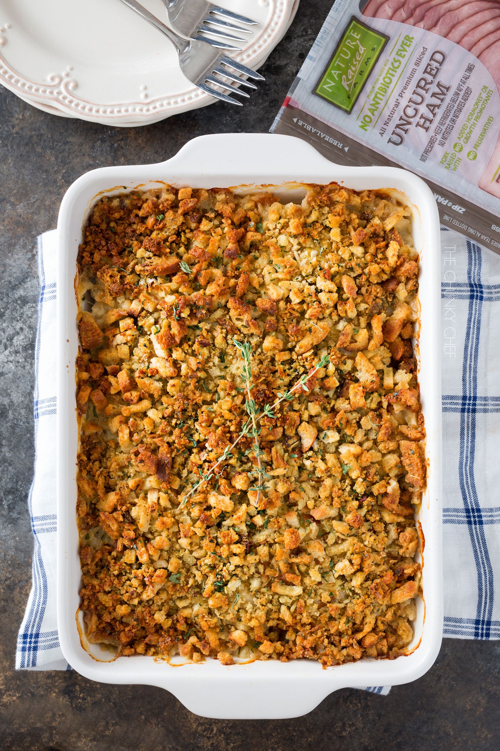 Chicken Cordon Bleu Casserole | A one pan family style casserole full of chicken, ham, swiss cheese, creamy herb sauce and savory stuffing! | http://thechunkychef.com