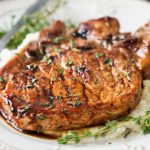 Maple Balsamic Glazed Pork Chops | Tender, juicy, bone-in glazed pork chops are seared and coated in a lip-smacking maple balsamic vinegar sauce! | http://thechunkychef.com