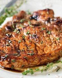 Maple Balsamic Glazed Pork Chops | Tender, juicy, bone-in glazed pork chops are seared and coated in a lip-smacking maple balsamic vinegar sauce! | http://thechunkychef.com
