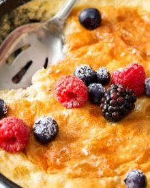 Mixed Berry Baked Oatmeal Souffle | Soft, fluffy oatmeal is folded with whipped egg whites and swirled with mixed berries, then baked until puffed and golden! | http://thechunkychef.com