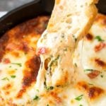 Cheesy Bacon Spinach Dip | This party spinach dip is loaded with tons of spinach, gooey cheese, crispy bacon and other mouthwatering flavors. Combine, bake, and eat! Perfect for a party! | http://thechunkychef.com