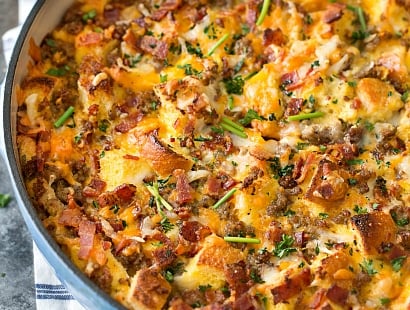 Overnight Breakfast Strata | This breakfast strata dish is made the night before, refrigerated overnight, then baked to bubbly, cheesy perfection! | http://thechunkychef.com