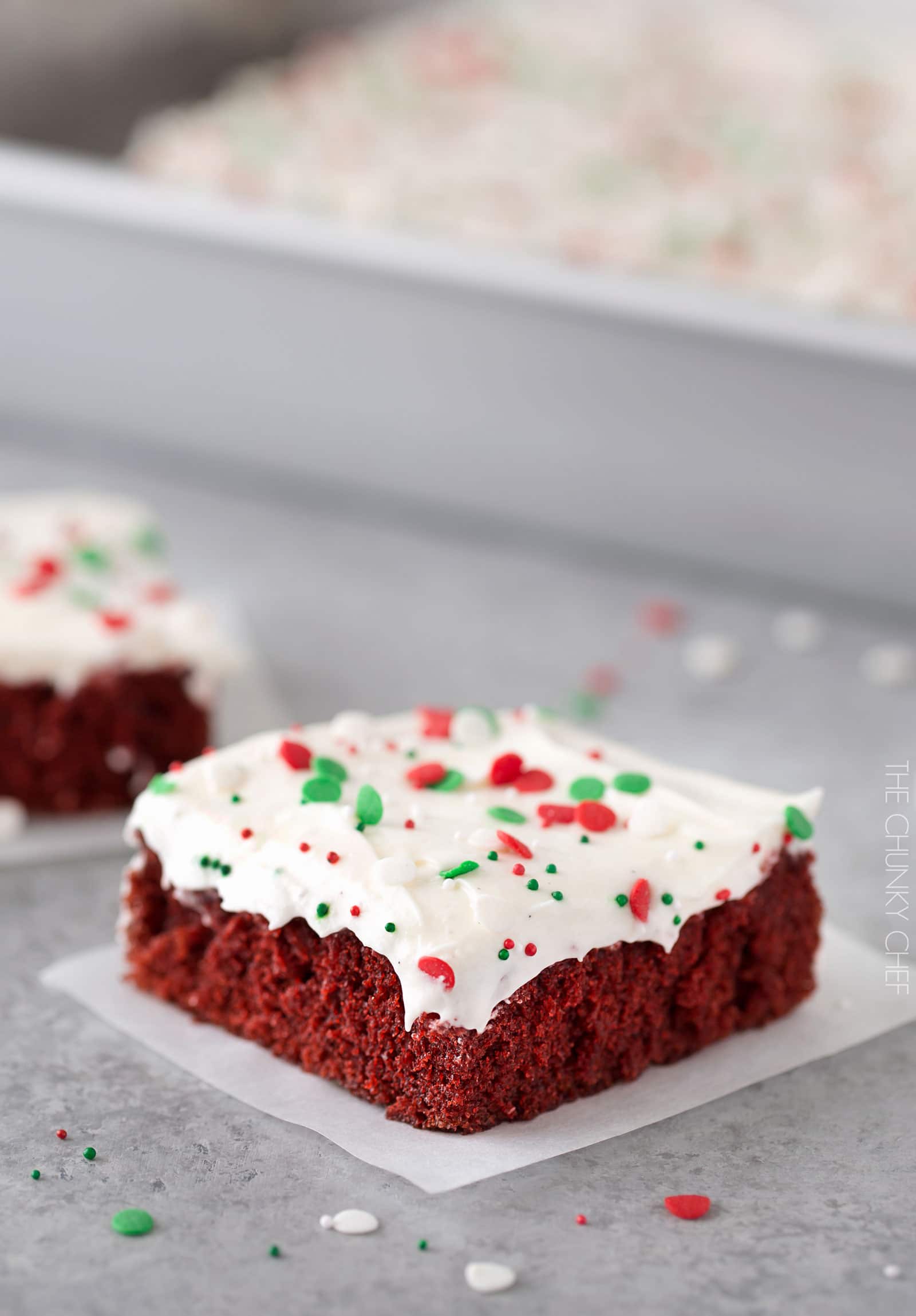 Red Velvet Brownies with Marshmallow Cream Cheese Frosting | Flavorful and festive red velvet brownies slathered in an ultra creamy frosting. Perfect for all holiday festivities, and easy to customize to other holidays as well! | http://thechunkychef.com