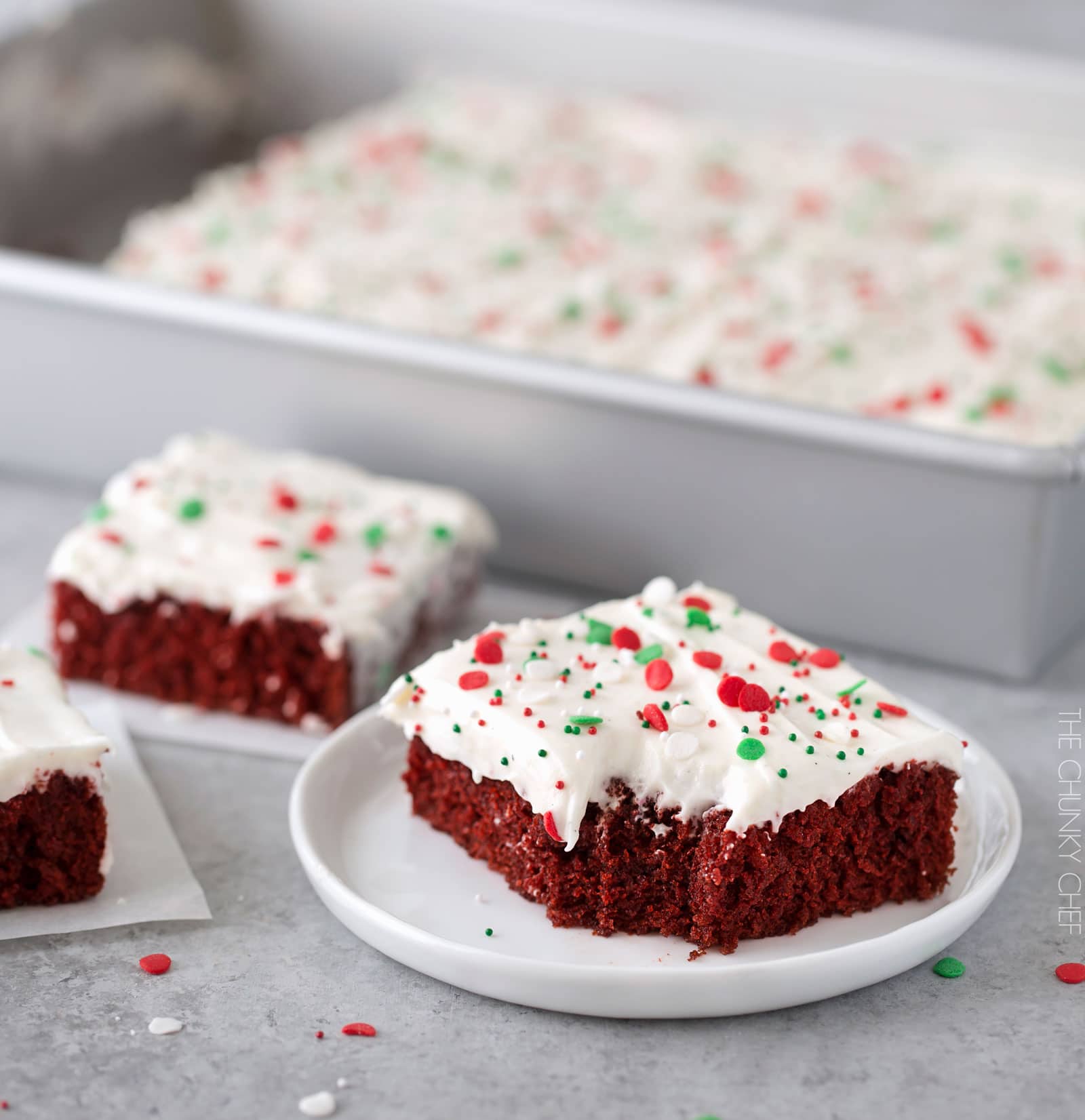 Red Velvet Brownies with Marshmallow Cream Cheese Frosting | Flavorful and festive red velvet brownies slathered in an ultra creamy frosting. Perfect for all holiday festivities, and easy to customize to other holidays as well! | http://thechunkychef.com