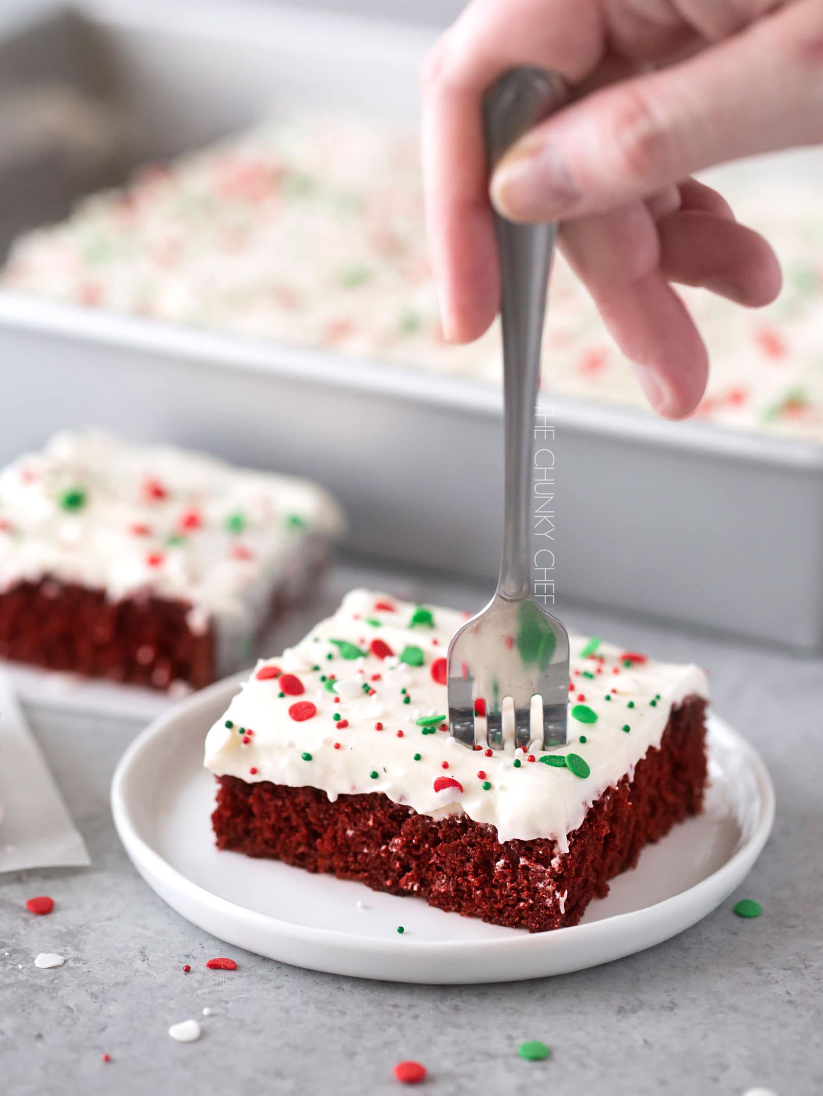 Red Velvet Brownies with Marshmallow Cream Cheese Frosting | Flavorful and festive red velvet brownies slathered in an ultra creamy frosting. Perfect for all holiday festivities, and easy to customize to other holidays as well! | http://thechunkychef.com