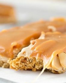 Salted Caramel Peanut Bars | These easy to make bars taste like a great candy bar! A soft pretzel flavored base is covered with a creamy nougat layer, sprinkled with peanuts, and coated in dreamy salted caramel! | http://thechunkychef.com