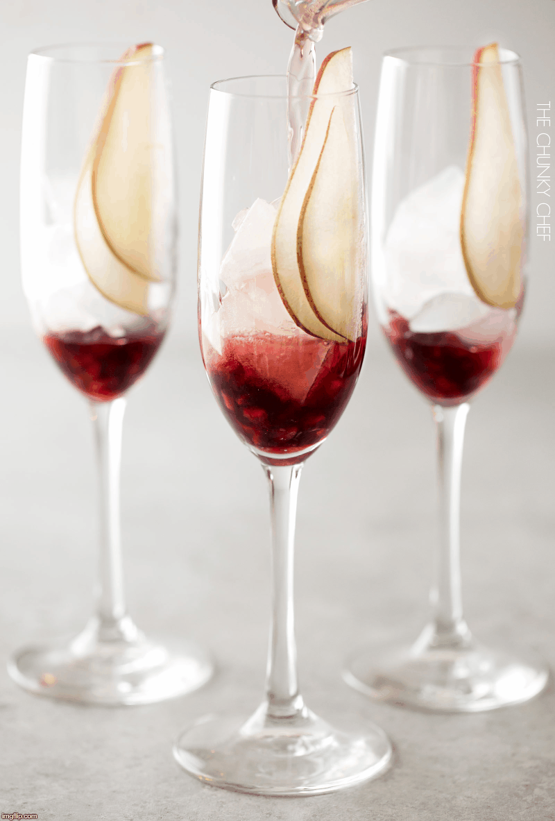Pear Pomegranate Bellini | A delightful combination of Prosecco and pear brandy create this light, bubbly, and elegant Bellini! As pretty as it is delicious, it's just the drink you need for your next party or date night! | http://thechunkychef.com