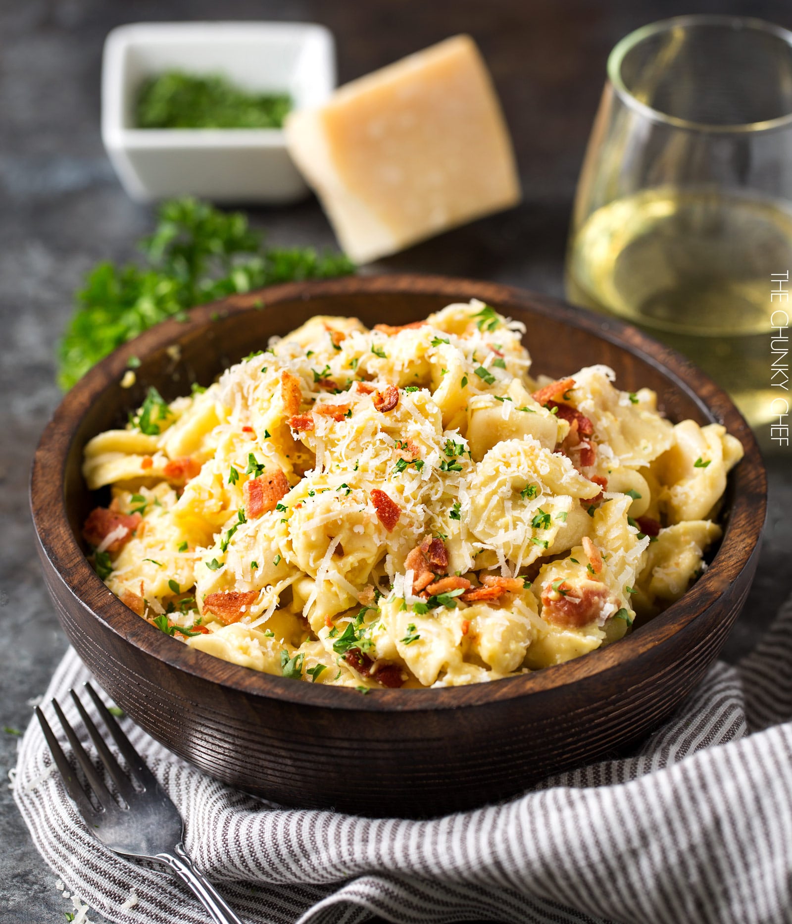 20 Minute Tortellini Pasta Carbonara | Cheese tortellini pasta is coated in a rich carbonara sauce, sprinkled with bacon and Parmesan cheese. It's the perfect weeknight dinner! | http://thechunkychef.com