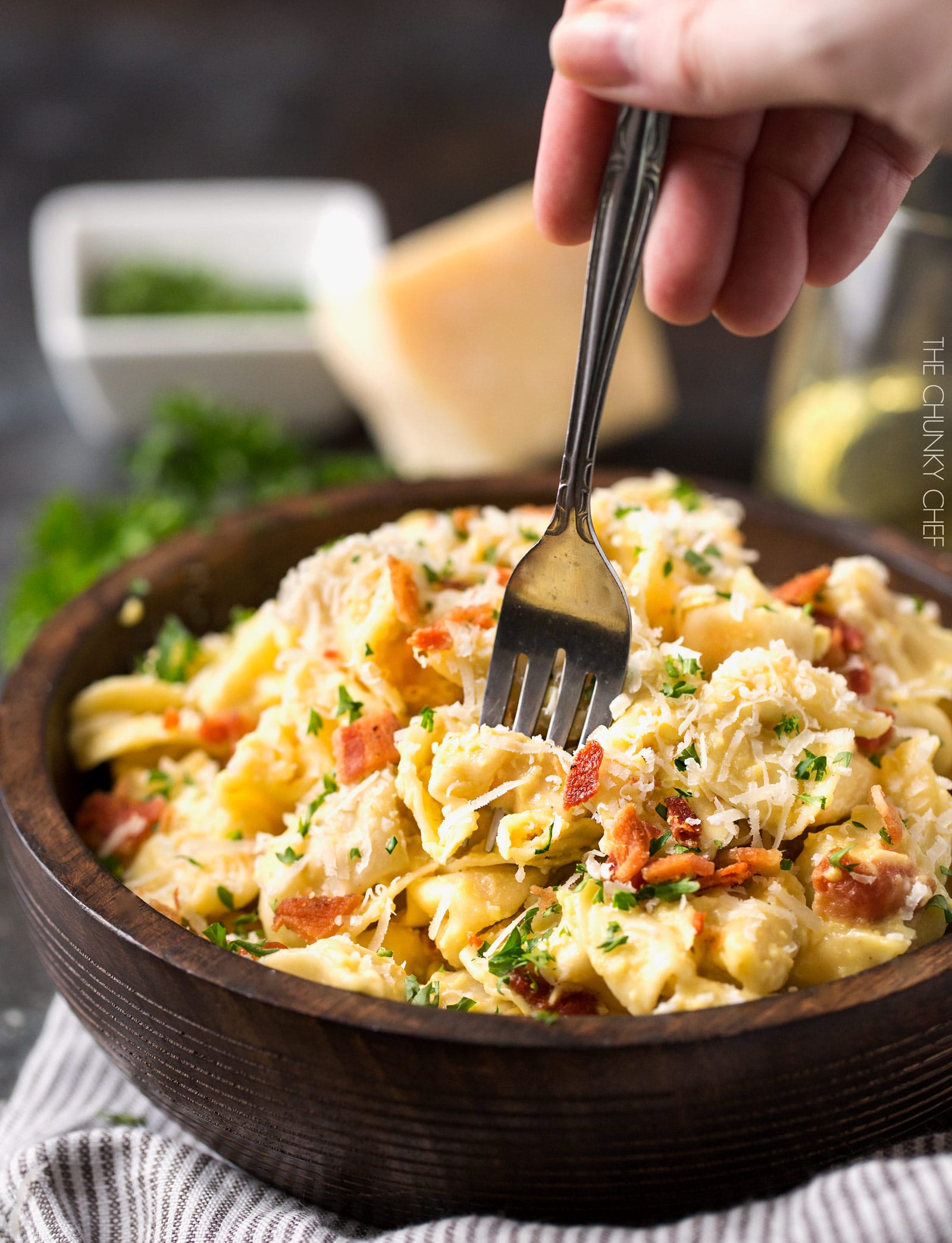 20 Minute Tortellini Pasta Carbonara | Cheese tortellini pasta is coated in a rich carbonara sauce, sprinkled with bacon and Parmesan cheese. It's the perfect weeknight dinner! | http://thechunkychef.com