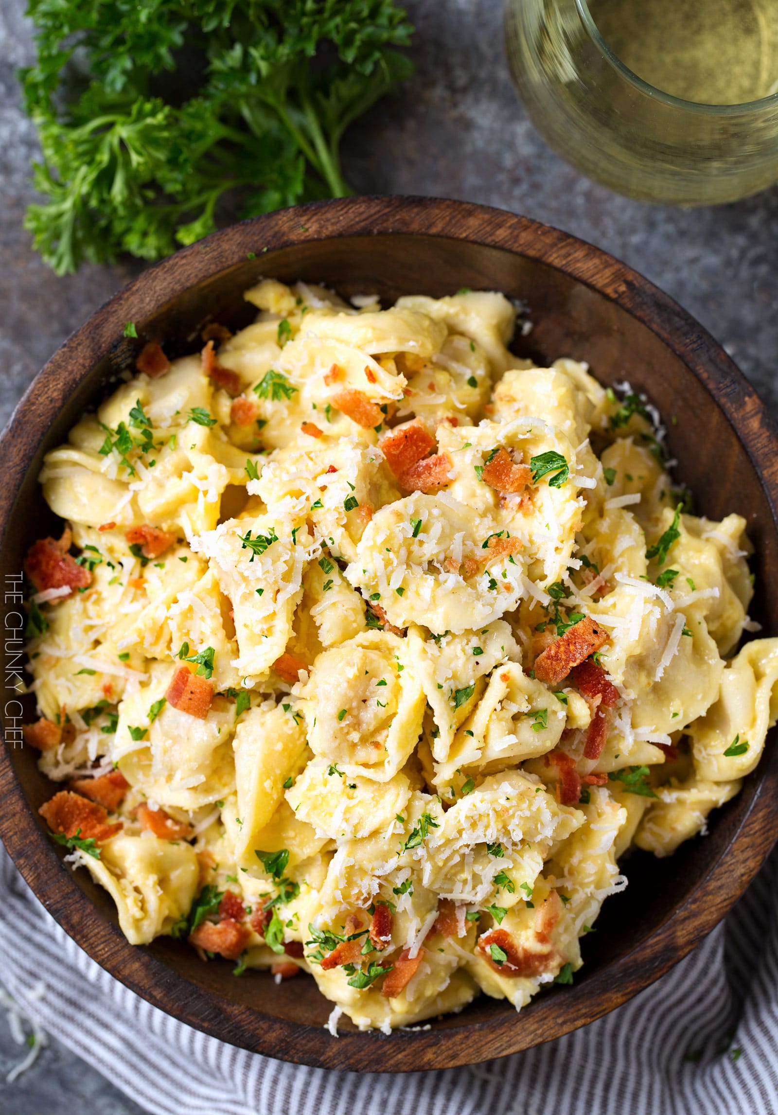 20 Minute Tortellini Pasta Carbonara | Cheese tortellini pasta is coated in a rich carbonara sauce, sprinkled with bacon and Parmesan cheese. It's the perfect weeknight dinner! | http://thechunkychef.com