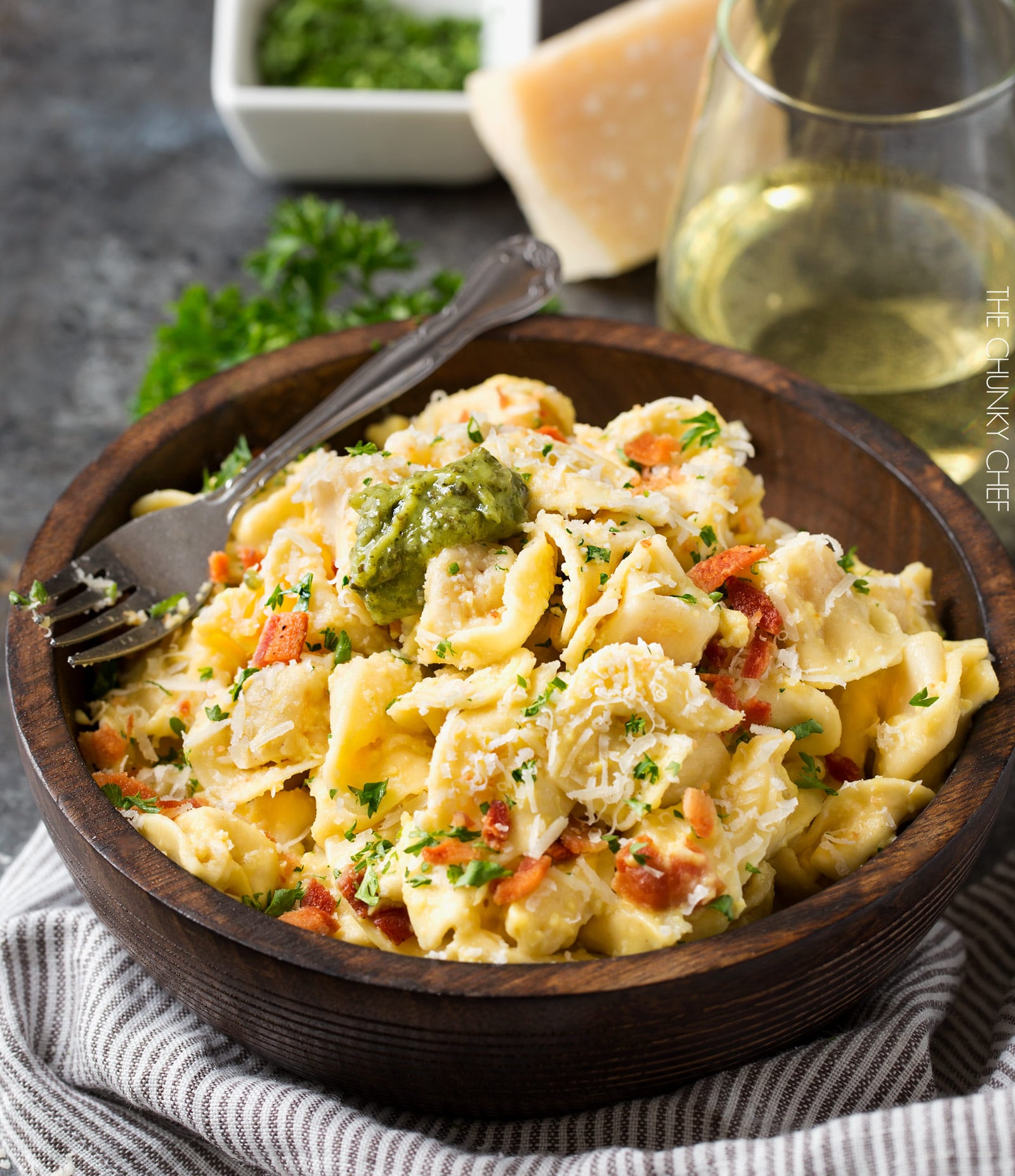 20 Minute Tortellini Pasta Carbonara | Cheese tortellini pasta is coated in a rich carbonara sauce, sprinkled with bacon and Parmesan cheese. It's the perfect weeknight dinner! | http://thechunkychef.com