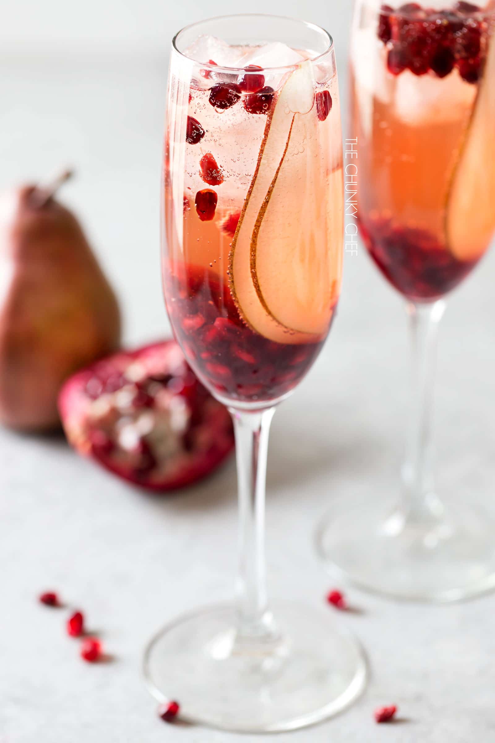 Pear Pomegranate Bellini | A delightful combination of Prosecco and pear brandy create this light, bubbly, and elegant Bellini! As pretty as it is delicious, it's just the drink you need for your next party or date night! | http://thechunkychef.com