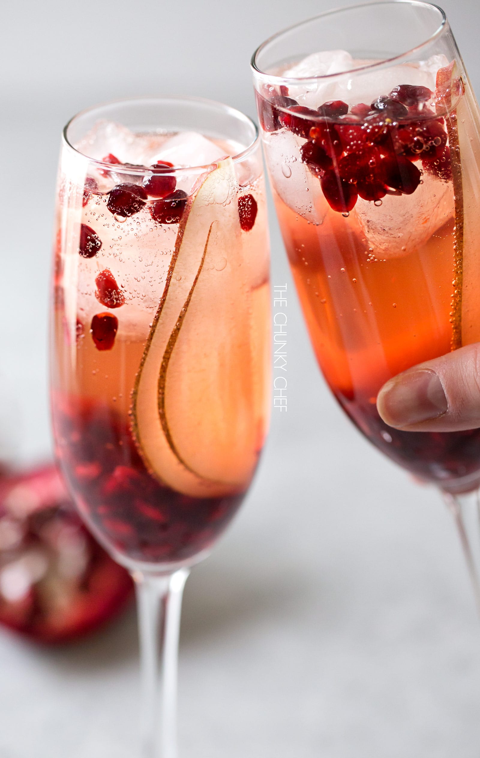 Pear Pomegranate Bellini | A delightful combination of Prosecco and pear brandy create this light, bubbly, and elegant Bellini! As pretty as it is delicious, it's just the drink you need for your next party or date night! | http://thechunkychef.com