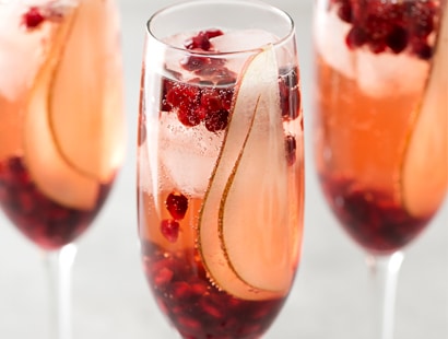 Pear Pomegranate Bellini | A delightful combination of Prosecco and pear brandy create this light, bubbly, and elegant Bellini! As pretty as it is delicious, it's just the drink you need for your next party or date night! | http://thechunkychef.com