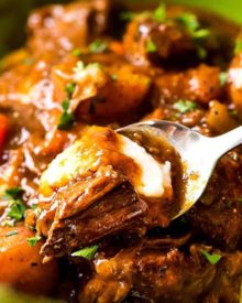 This comfort food is the King of all Irish beef stews, with the Guinness and coffee flavors melding perfectly to give way to a deep, rich, lusciously savory sauce that simmers away to tenderize the beef and vegetables until they're spoonable! #beefstew #irish #stpatricksday #stew #beef #guinness #coffee #slowcooker #crockpot #instantpot #pressurecooker