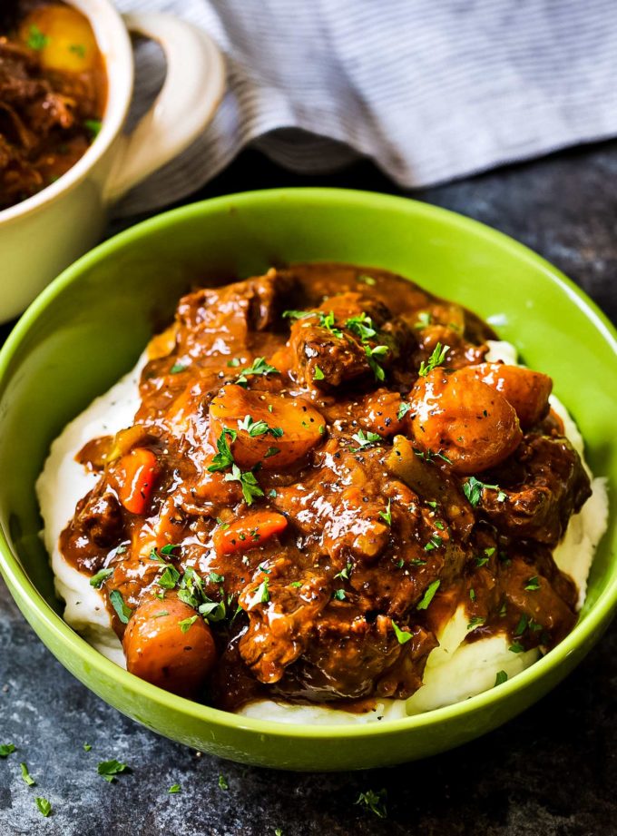 Irish beef stew in bowl with mashed potatoes