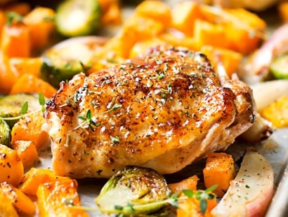 Sheet Pan Maple Mustard Roasted Chicken | Chicken thighs are coated in a sweet and savory maple mustard sauce and roasted alongside creamy butternut squash and savory brussels sprouts, all on one sheet pan for an incredibly quick, easy meal with hardly any cleanup needed! | http://thechunkychef.com