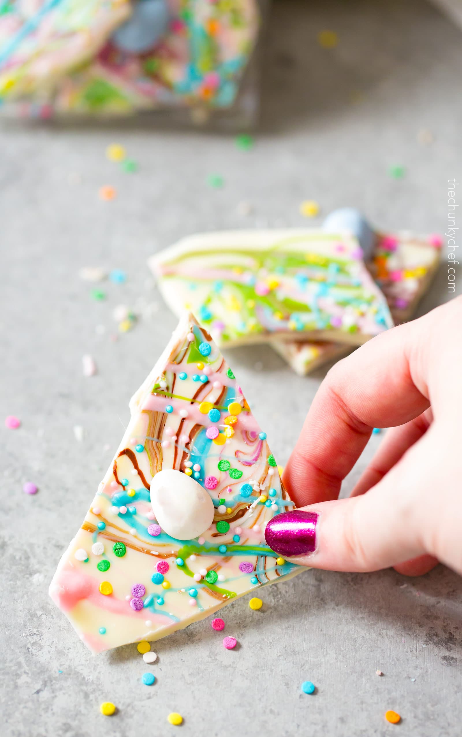 Brownie Batter White Chocolate Bark | A fun no bake bark dessert, made with white chocolate swirled together with milk chocolate brownie batter, and decorated in fun Spring colors! Easily customizable to any holiday and makes a great homemade gift! | http://thechunkychef.com