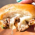 Baked Italian Beef Sliders | Slider buns are piled high with shredded Italian beef and gooey provolone cheese, brushed with melted garlic butter and baked until gooey and mouthwatering! | http://thechunkychef.com