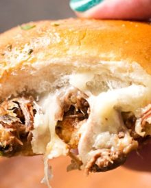 Baked Italian Beef Sliders | Slider buns are piled high with shredded Italian beef and gooey provolone cheese, brushed with melted garlic butter and baked until gooey and mouthwatering! | http://thechunkychef.com