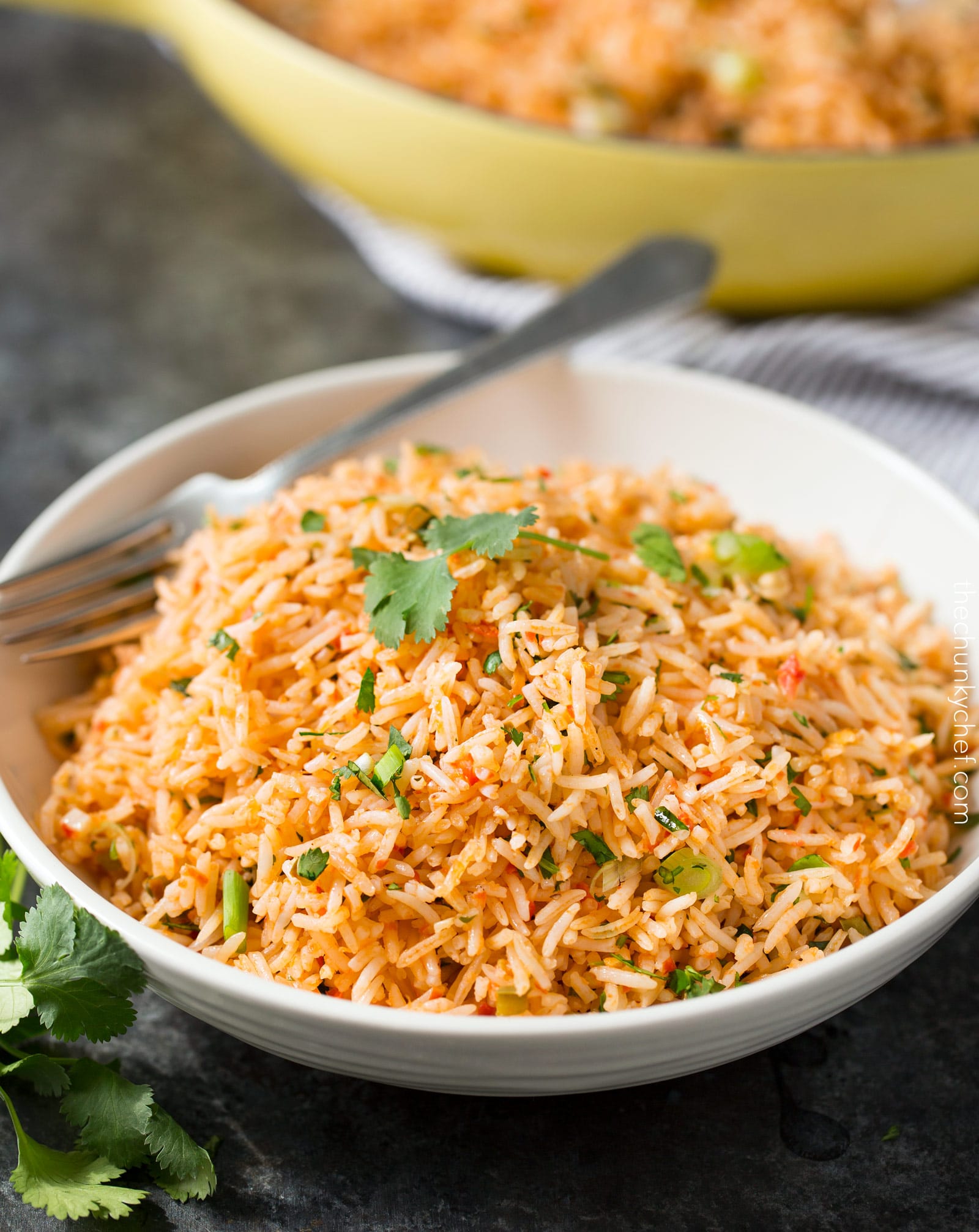 Easy Baked Mexican Rice | This foolproof method for cooking rice tastes just like the rice from your favorite Mexican restaurant... full of flavor and cooked to perfectly fluffy perfection! | http://thechunkychef.com
