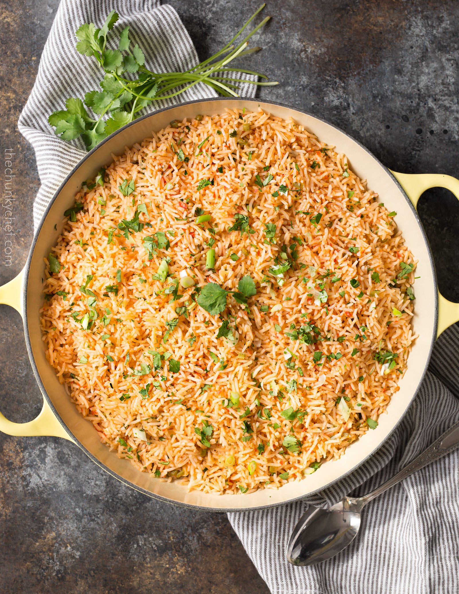 Easy Baked Mexican Rice | This foolproof method for cooking rice tastes just like the rice from your favorite Mexican restaurant... full of flavor and cooked to perfectly fluffy perfection! | http://thechunkychef.com