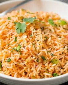 Easy Baked Mexican Rice | This foolproof method for cooking rice tastes just like the rice from your favorite Mexican restaurant... full of flavor and cooked to perfectly fluffy perfection! | http://thechunkychef.com