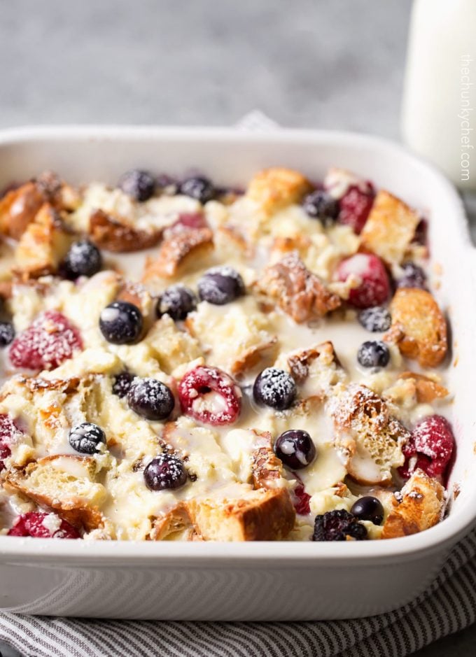 berry croissant bake in baking dish with glaze