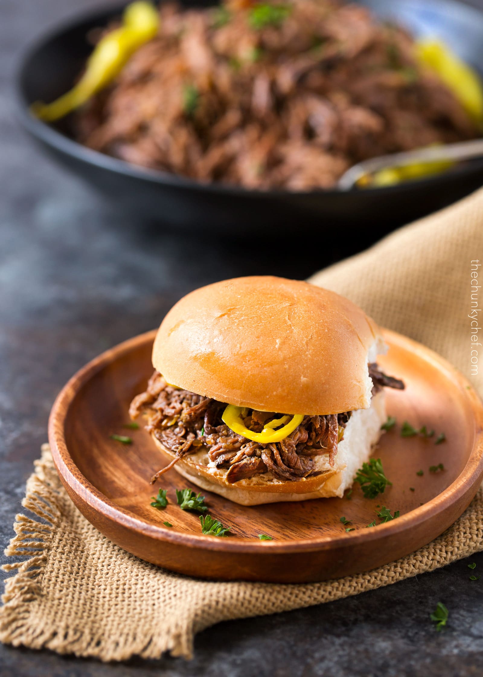 Slow Cooker Shredded Italian Beef | Tangy and spicy, this Italian beef is easily cooked in a slow cooker until fork tender, then shredded, for the ultimate in delicious easy weeknight dinners! | http://thechunkychef.com