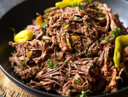 Slow Cooker Shredded Italian Beef | Tangy and spicy, this Italian beef is easily cooked in a slow cooker until fork tender, then shredded, for the ultimate in delicious easy weeknight dinners! | http://thechunkychef.com