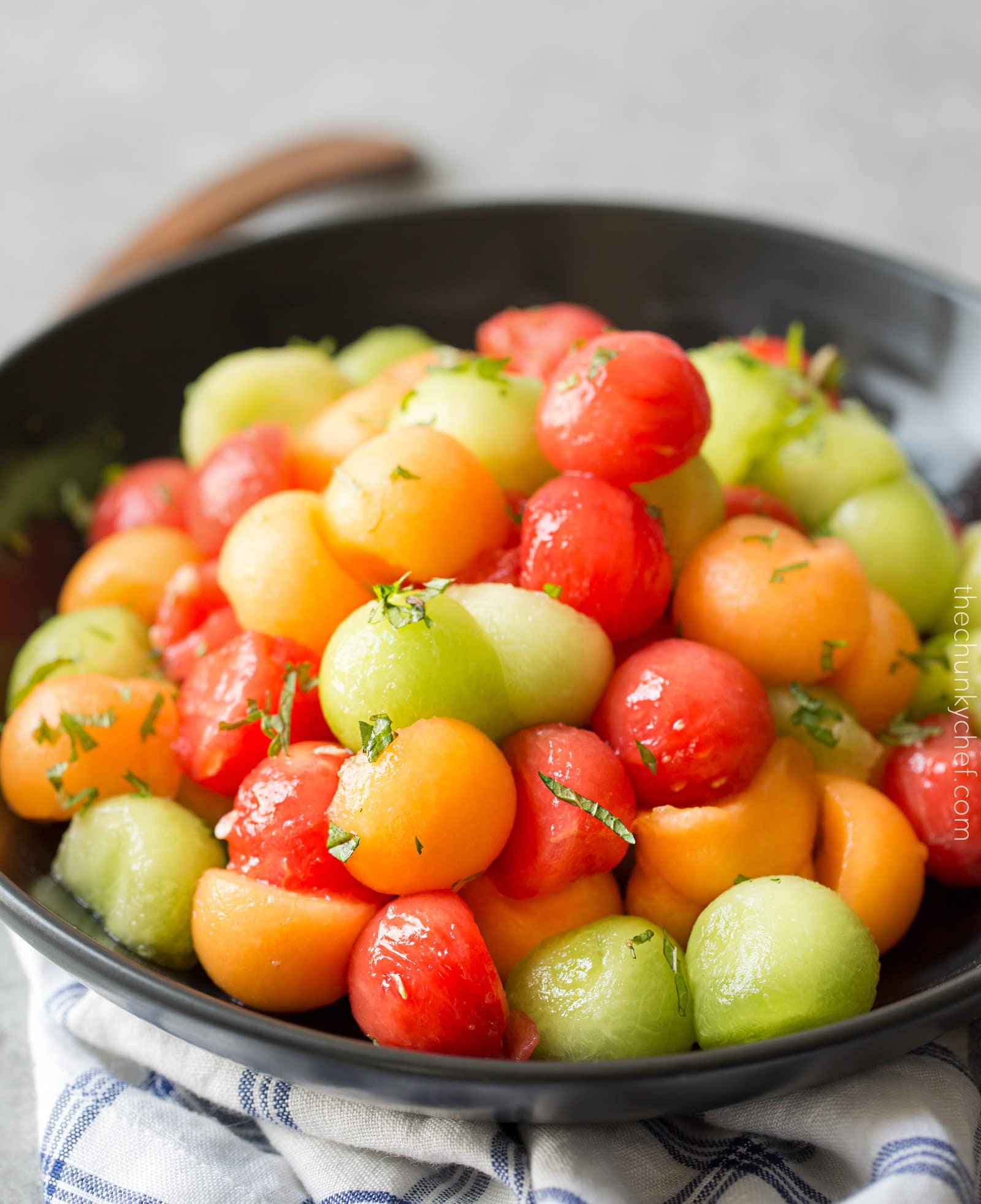 Summer Fruit Salad with Serrano Mint Syrup | A refreshing fruit salad made with a variety of summer fruits, tossed in an easy simple syrup made with mint and serrano pepper! | http://thechunkychef.com