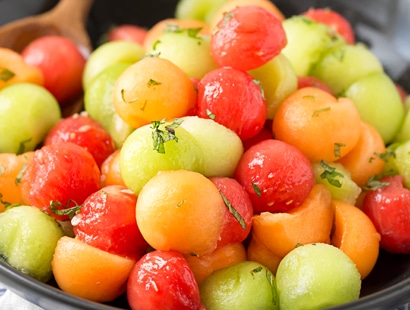 Summer Fruit Salad with Serrano Mint Syrup | A refreshing fruit salad made with a variety of summer fruits, tossed in an easy simple syrup made with mint and serrano pepper! | http://thechunkychef.com