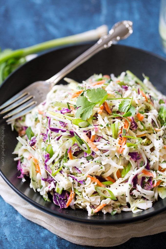 bowl of coleslaw with a serving fork.